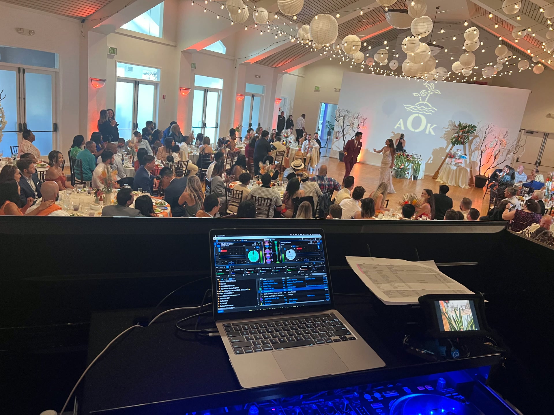 Wedding first dance in front of a custom monogram projection